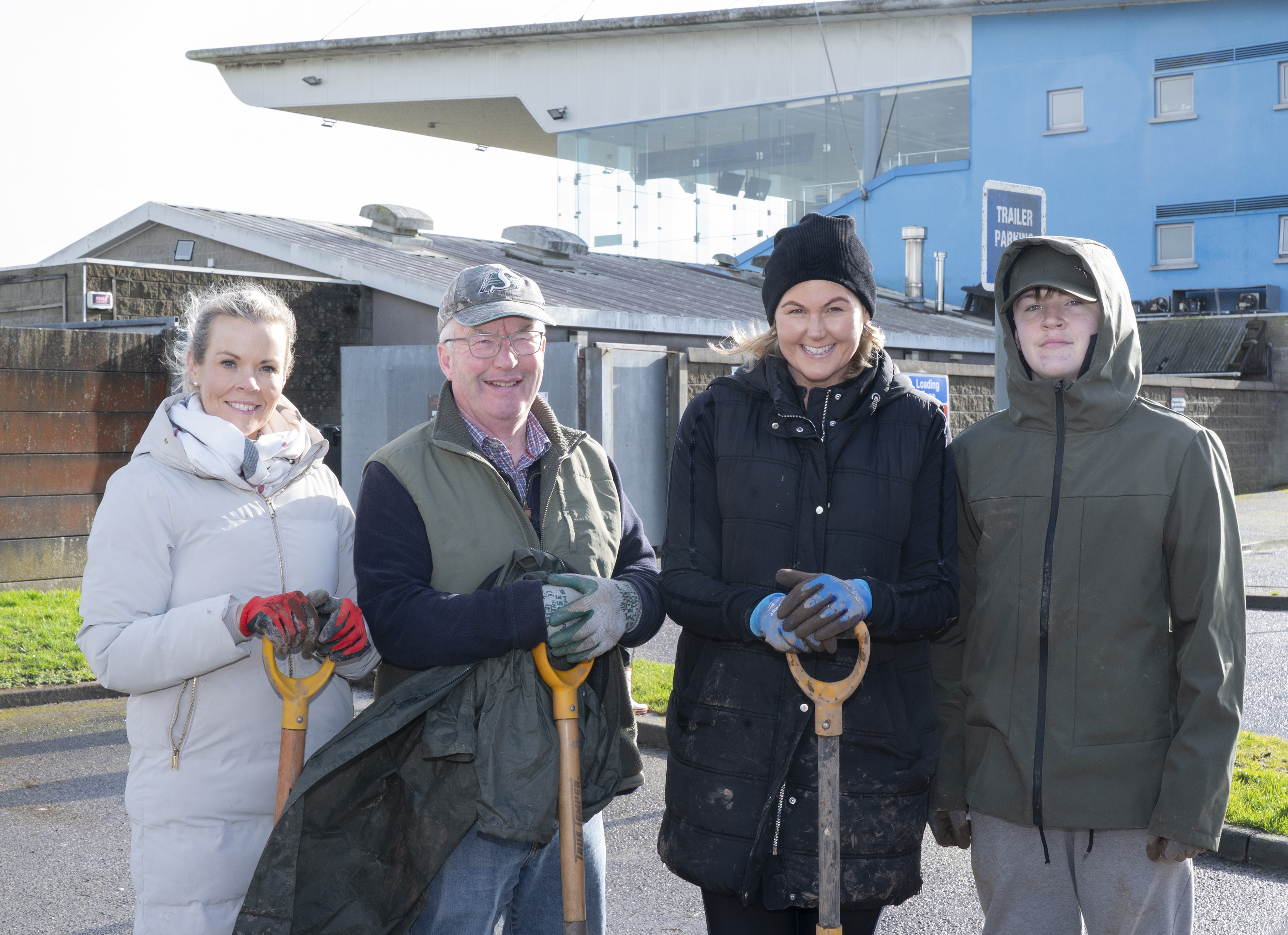 Members of the Friends of Curraheen Park Greyhound Stadium and volunteers from STS Group Cork pose with spades outside Curraheen Park Greyhound Stadium during the planting of 770 native Irish trees as part of a biodiversity initiative.