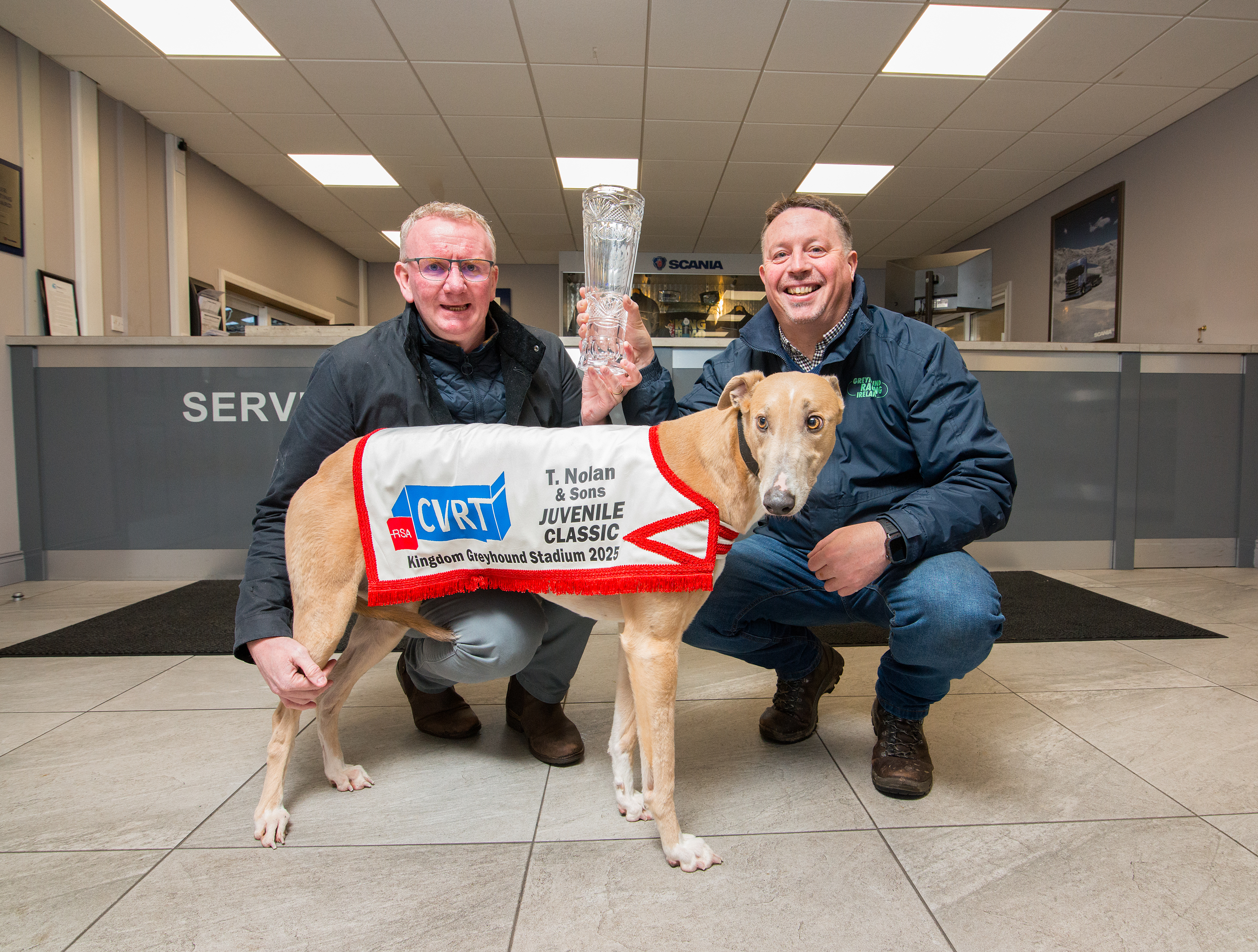 Tom Nolan pictured with his Greyhound Angel and Racing Manager Kieran Casey of Kingdom Greyhound Stadium